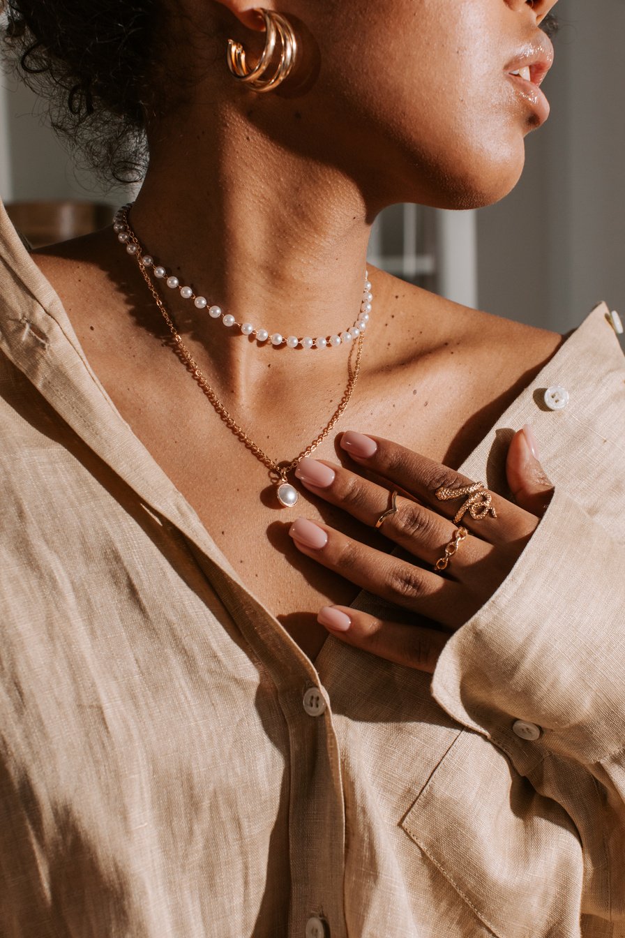 Woman Wearing Gold Jewelry